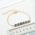 Gold Tone Multi Link Evil Eye Chain Bracelet with Six Round Charms view 4