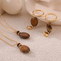 Gold Titanium Steel Tigers Eye Oval Pendant Necklace Earring Set view 1