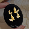 Gold Dual Butterfly Drop Earrings Crystal Pavé Wings view 1
