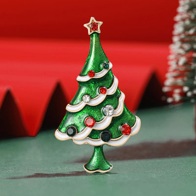 A green Christmas tree with white garland and red ornaments shown on a white background.