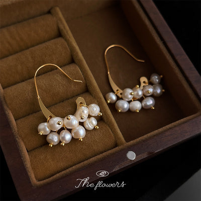 Gold crescent pearl cluster fishhooks in brown velvet jewelry box