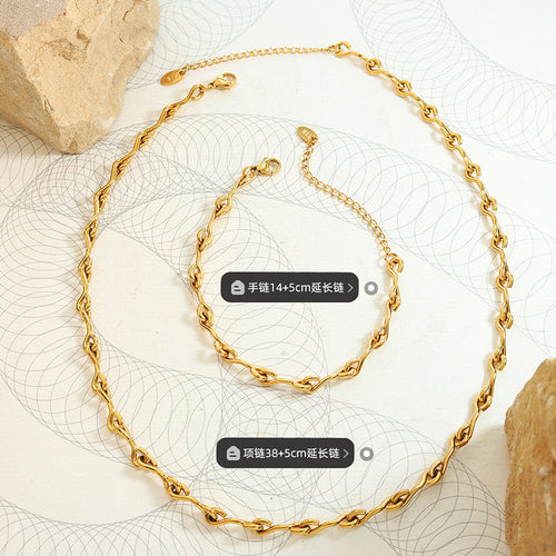 Gold U-link necklace and bracelet flat lay with length labels