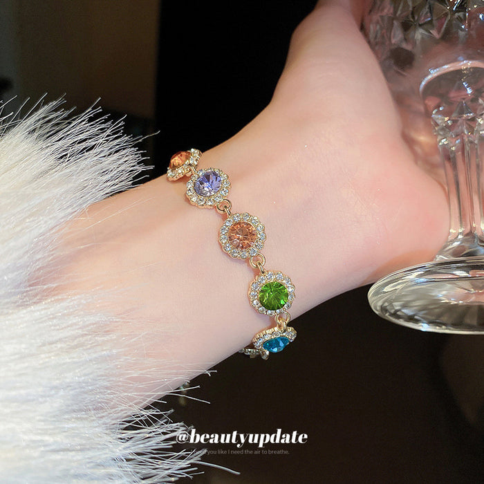 Gold Tone Bracelet With Seven Multicolor Round Crystal Halo Links