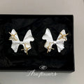 Silver Tone Bow And Gold Tone Star Accent Stud Earrings view 4