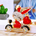 Jeweled Scooter Rabbit Keychains in Pink Red and Blue Plain Configurations view 1
