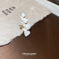 White Orchid Ear Cuff with Gold Tone Floral Details view 4