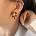 Gold Tone Red Firework Stud Earrings with Clear Crystals view 2