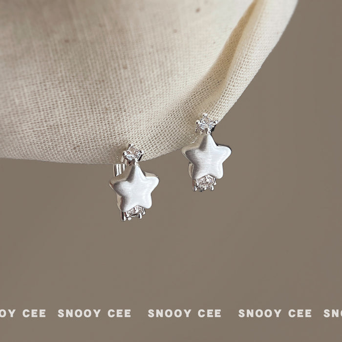 Silver Tone Brushed White Star And Clear Stone Huggie Earrings