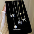 Bow and Pearl Drop Necklace in Three Gold and Silver Styles view 1