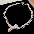 Silver Tone Bow Necklace with Textured Ribbon Links view 6