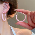 Color Coated Medium Hoop Earrings in White and Pink view 4