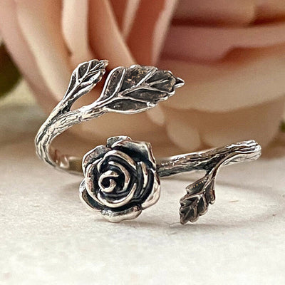 Antique silver rose flower leaf open wrap ring soft pink rose background