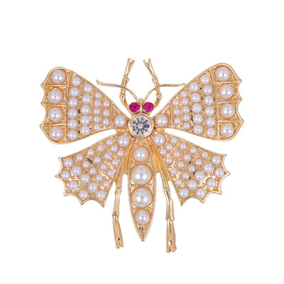Front product view of an 18k gold butterfly brooch
