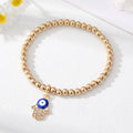 Gold Tone Beaded Teardrop Evil Eye and Hamsa Charm Bracelets view 8