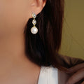 Gold Tone Triple Circle Earrings With White Pearl Drops view 3