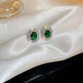 Green Oval Crystal Stud Earrings with Silver Tone Border view 4