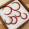 Red Coated Hoop Stud Earrings In Three Graduated Sizes view 4
