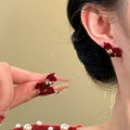 Red Flocked Horse Bow Stud Earrings with Distinctive Textured Details view 2