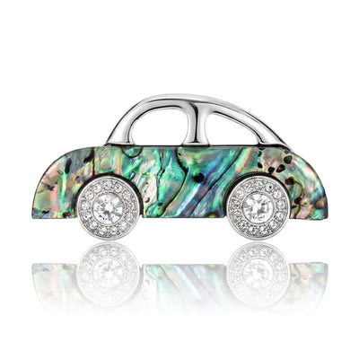 Front view of abalone shell pattern car brooch with crystal wheels