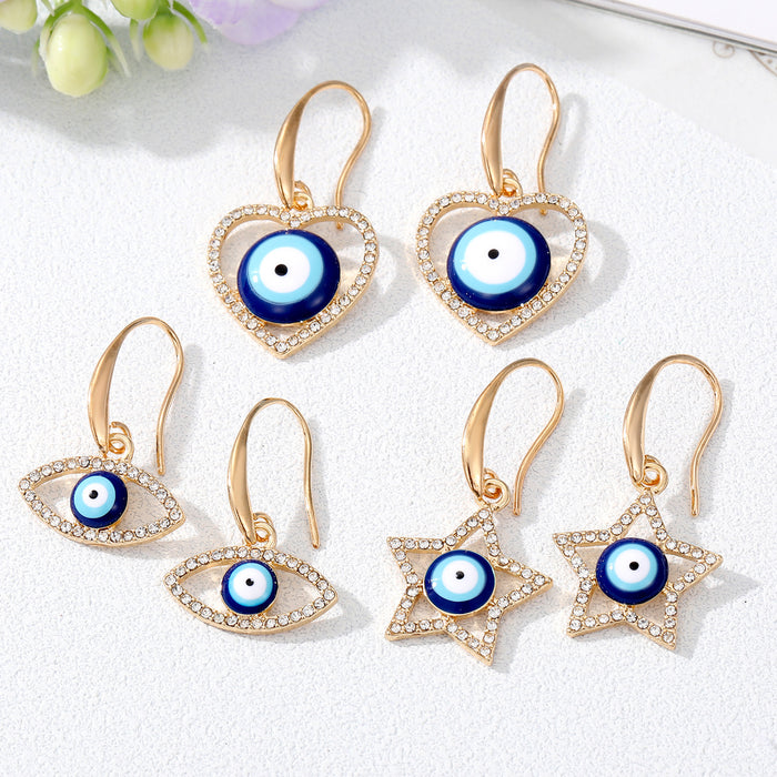 Gold Tone Crystal Heart Star and Evil Eye Hook Earrings