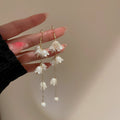 White Bellflower Cluster Pearl Chain Drop Earrings view 1
