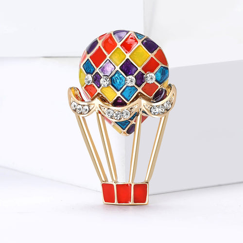 Balloon brooch angled on white geometric display block