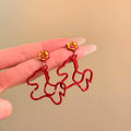 Red Enamel Horse Drop Earrings with Gold Tone Floral Studs view 3