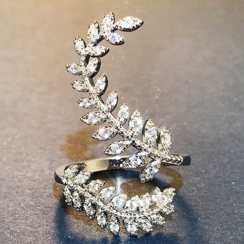 Second product view showing long silver-tone leaf branch open ring