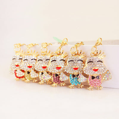 A row of crowned chick keychains displays six colored rhinestone bodies.