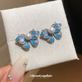 Blue Butterfly Stud Earrings with Pearl Like Centers and Crystals view 4