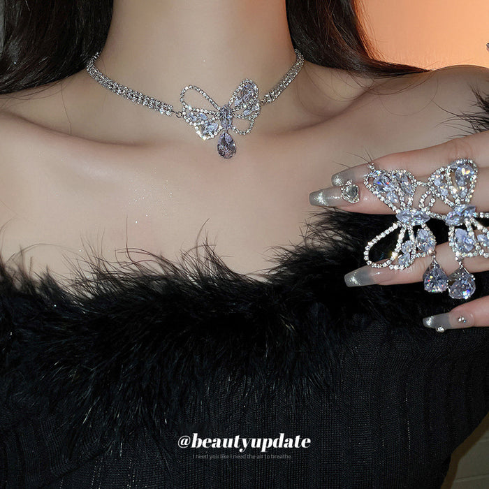 Silver Tone Crystal Bow Necklace And Earrings With Teardrop Drops