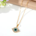 Gold Tone Crystal Evil Eye Necklace and Huggie Earring Options view 6
