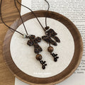 Brown Leopard Bow and Cross Pendant Necklace on Black Cord view 2