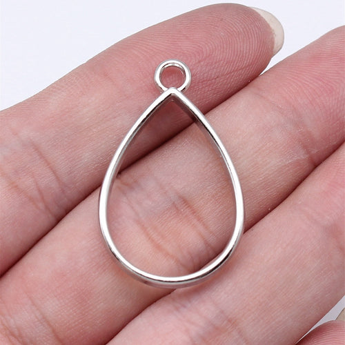 Teardrop Open Frame Pendants in Four Metal Finishes shown in image 1, highlighting a smooth open teardrop outline and sm