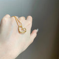 Twisted Open Heart Pendant Necklace on Fine Gold Tone Chain view 4