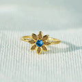 Gold Tone Flower Ring With Blue Center and Green Petals view 2
