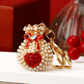 Hollow Palace Bell Keychains in Gold and Silver Tone Finishes view 5