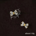 Gold Tone Clear CZ Bow Stud Earrings Teardrop Stone Design view 4