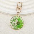 Gold Tone Round Pressed Daisy Resin Clip Keychains view 7