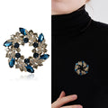 Colorful Crystal Wreath Brooch With Polished Metal And Sculpted Decorative Details view 2