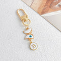 White Enamel Butterfly Evil Eye Letter Charm Gold Keychain view 4