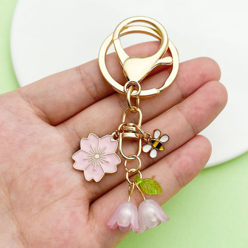 Image 2 showing a person holding a flower and ring.