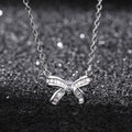 Silver Tone Bow Pendant Necklace With Clear Stones view 4