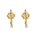 Gold Tone Iris Key Shape Purple And Clear Stone Stud Earrings view 5