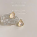 Gold Tone Irregular Translucent Cream Stone Like Stud Earrings view 1
