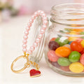 Pink Faux Pearl Wristlet Keychain Red Glitter Heart Charm view 3