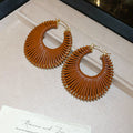 Woven Open Circle Huggie Earrings In Eight Designs view 10
