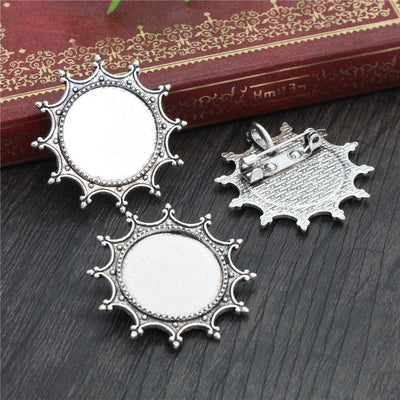 Sunburst Round Brooch Bezel Setting in Antique Silver assortment on a plain background