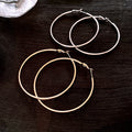 Slim Metal Round Hoop Earrings in Gold and Silver Tones view 1