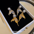 Gold Tone Mermaid Tail Stud Earrings With Pearl Accents view 4